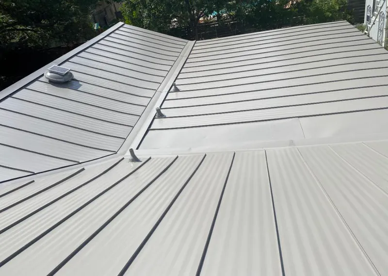 Solar attic fan installed on a metal roof for Roof Ventilation in Salt Lake City